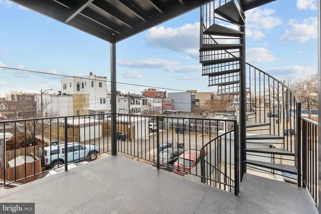 a view of a balcony with city view