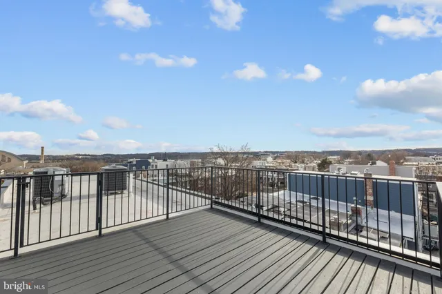a view of a balcony with wooden floor