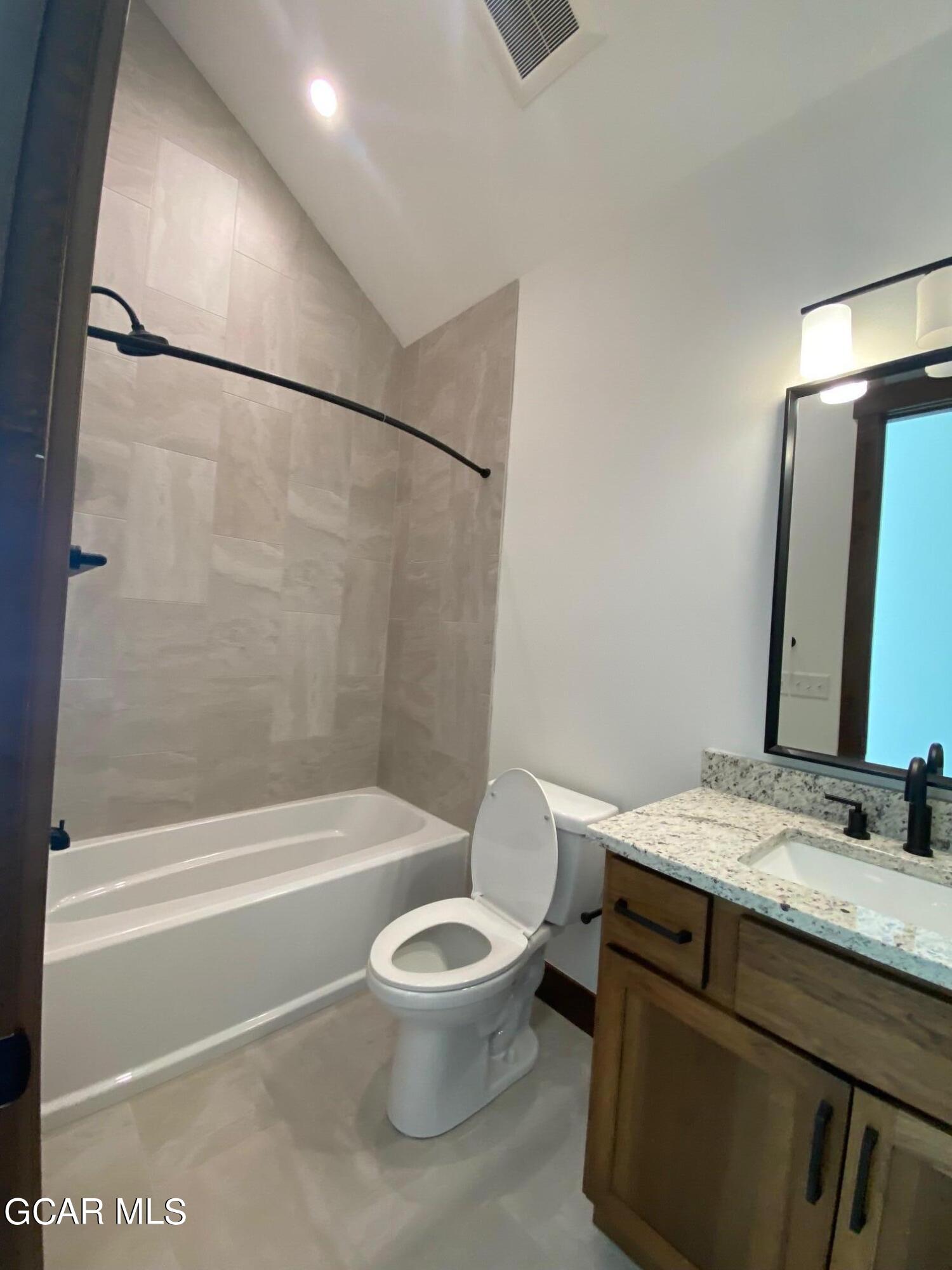 168 Hay Meadow Drive Fraser, CO 80442 - Photo 22 of 35 a bathroom with a granite countertop sink toilet and shower