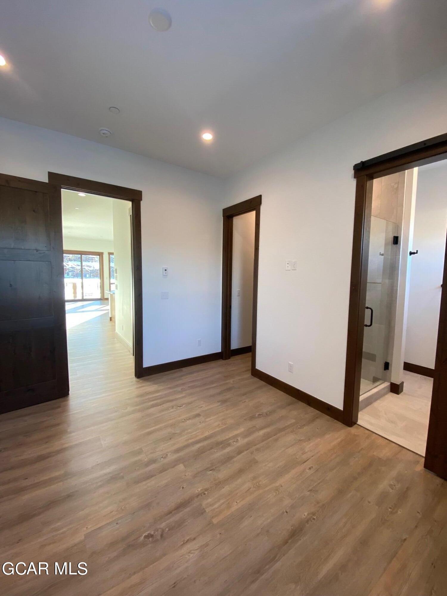 168 Hay Meadow Drive Fraser, CO 80442 - Photo 25 of 35 a view of a livingroom with wooden floor and windows