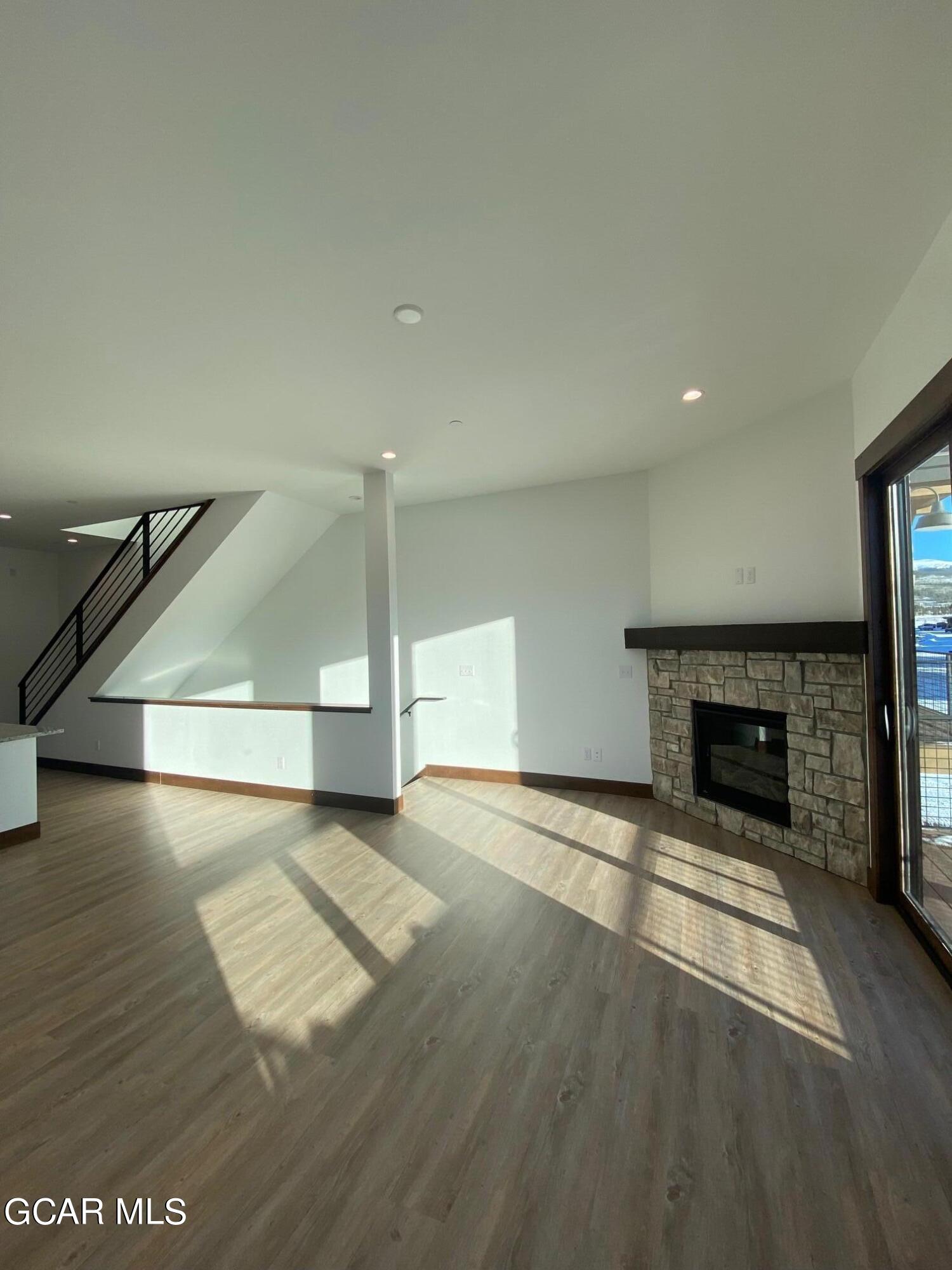 168 Hay Meadow Drive Fraser, CO 80442 - Photo 34 of 35 a view of an empty room with a fireplace and a window