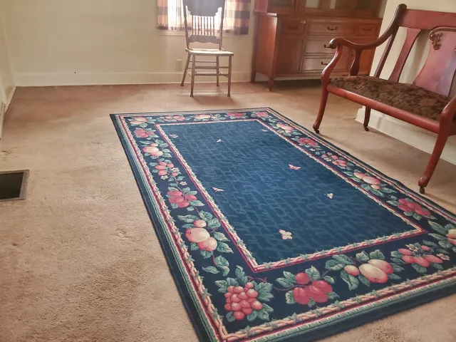 a view of a room with furniture and a window