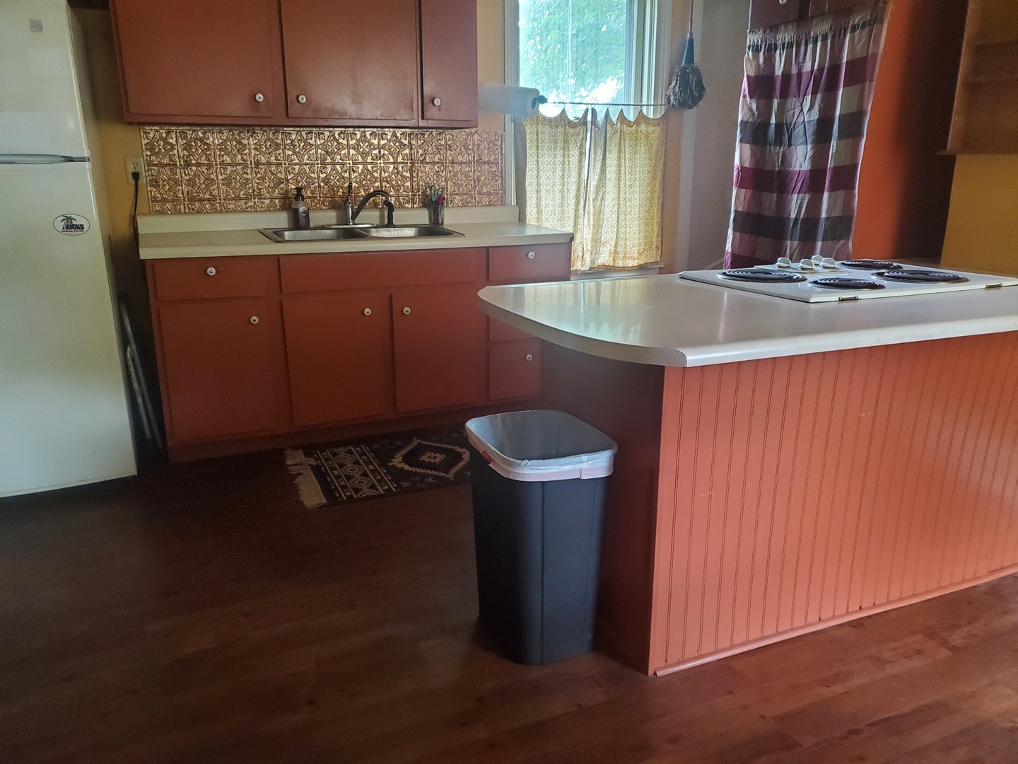 322 North Peoria Street Gilman, IL 60938 - Photo 14 of 15 a kitchen with a sink and a stove
