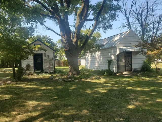 a big yard with large trees