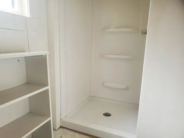 a bathroom with a bath tub