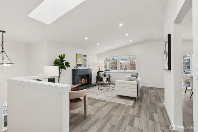 a en suite bathroom with a granite countertop sink and a mirror