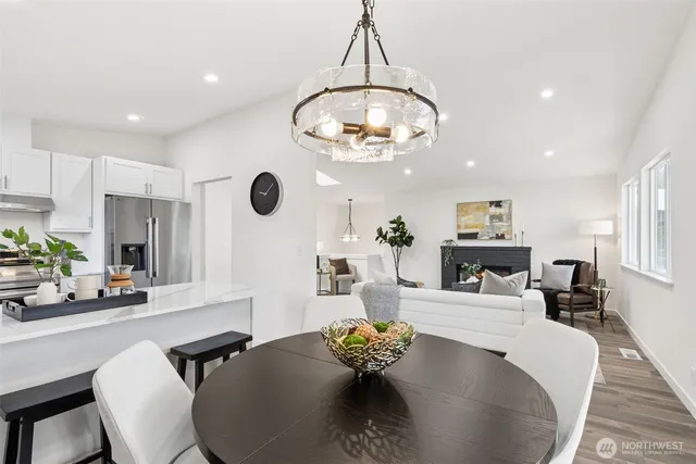 a living room with furniture and a book shelf