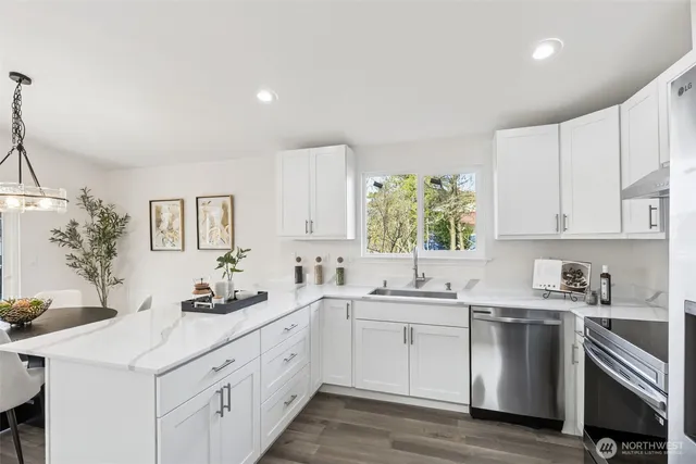 a view of a chairs and table in the balcony