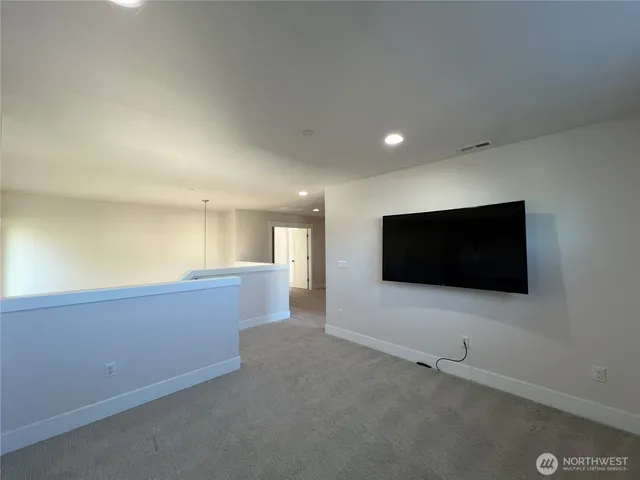 a living room with a flat screen tv