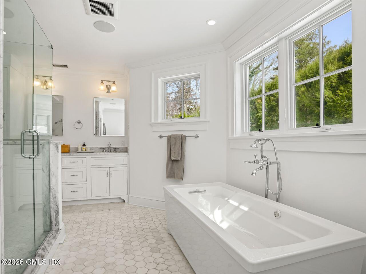 21 Lake Drive Riverside, CT 06878 - Photo 13 of 39 a bathroom with a tub sink and mirror