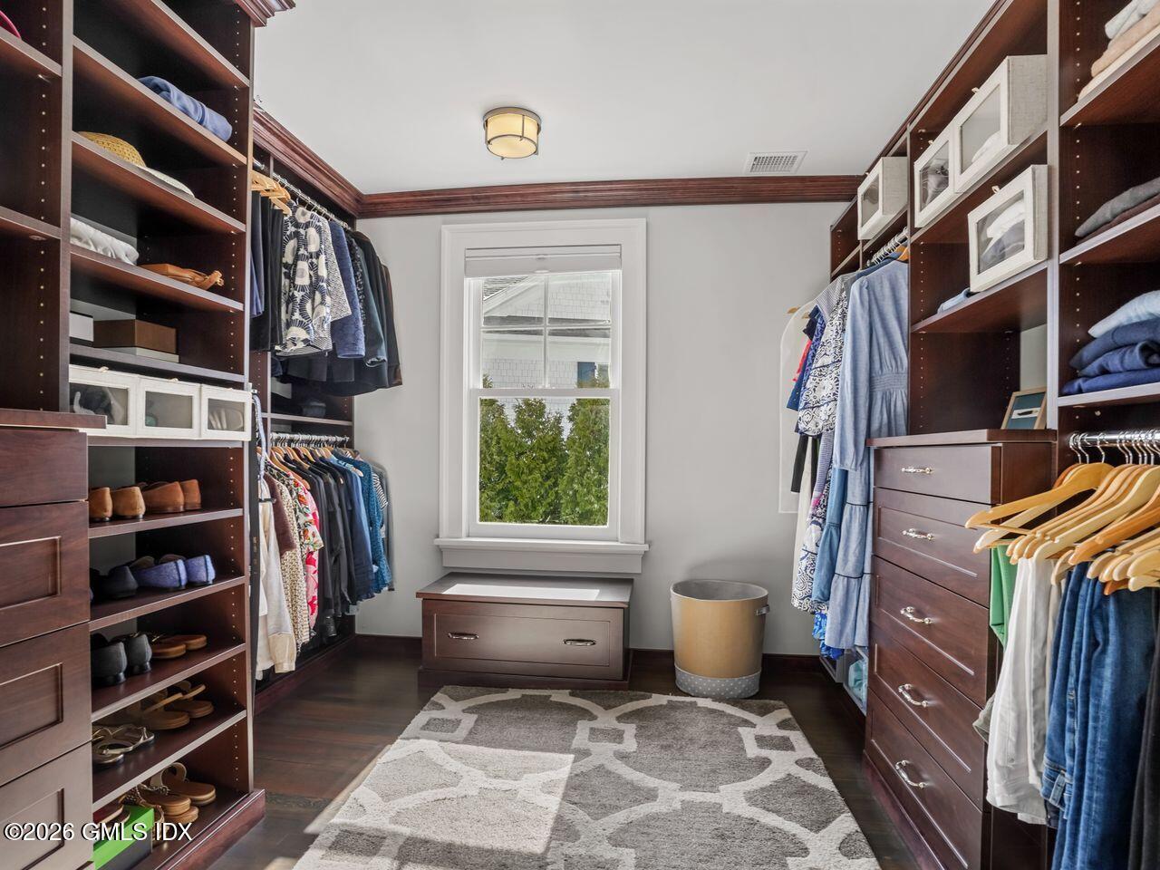 21 Lake Drive Riverside, CT 06878 - Photo 14 of 39 a view of walk in closet with clothes and shoes