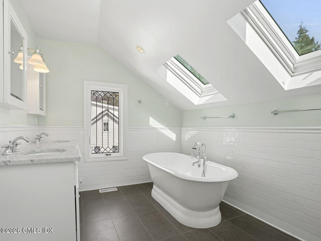 21 Lake Drive Riverside, CT 06878 - Photo 20 of 39 a bathroom with a sink and a mirror