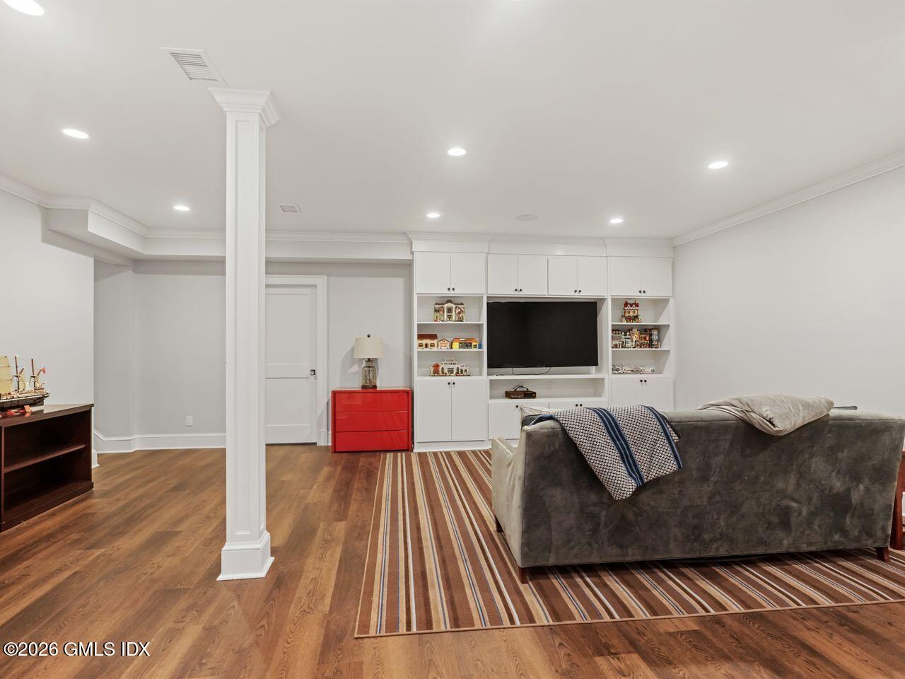 21 Lake Drive Riverside, CT 06878 - Photo 21 of 39 a living room with furniture and a flat screen tv