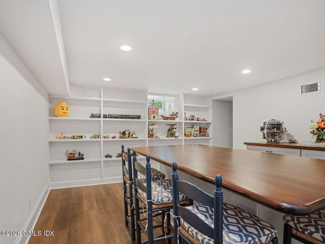21 Lake Drive Riverside, CT 06878 - Photo 24 of 39 a view of a kitchen with kitchen island a table and chairs in it