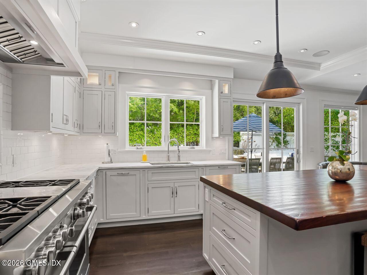 21 Lake Drive Riverside, CT 06878 - Photo 27 of 39 a kitchen with sink a window and cabinets