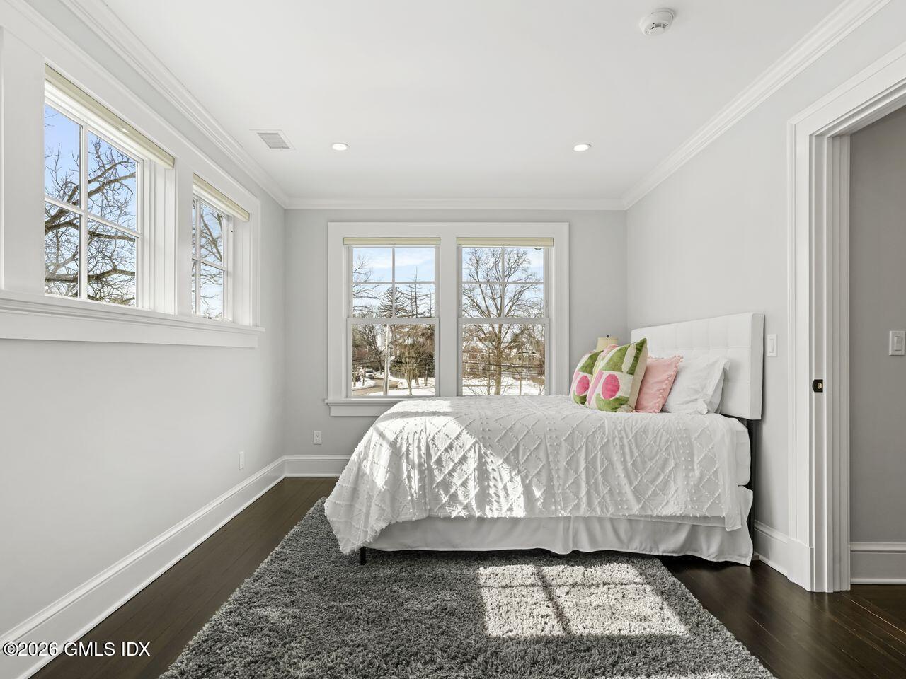 21 Lake Drive Riverside, CT 06878 - Photo 29 of 39 a bed sitting in a bedroom next to a window