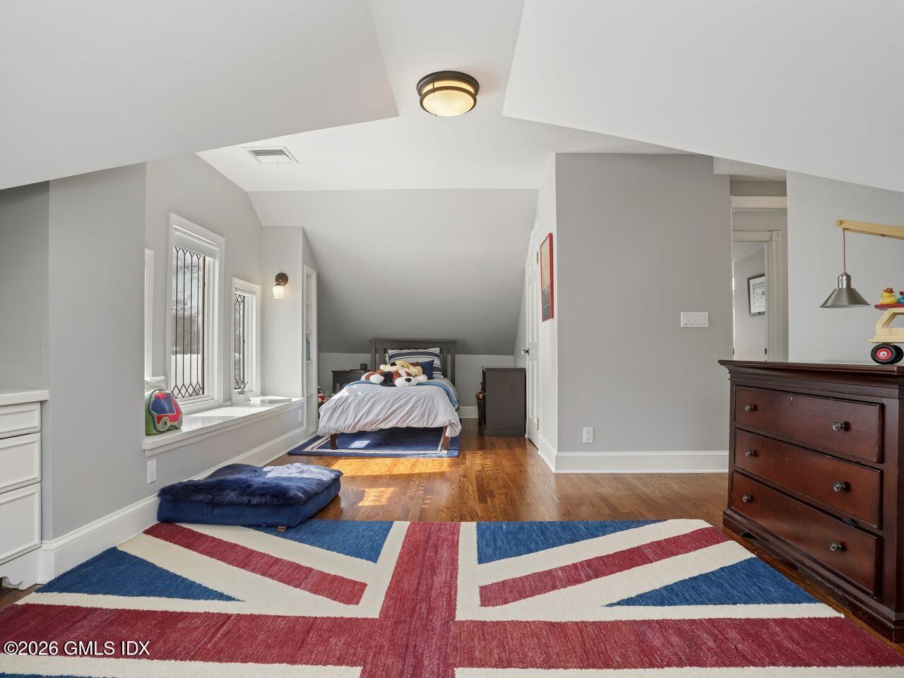 21 Lake Drive Riverside, CT 06878 - Photo 30 of 39 a living room with a bed and furniture