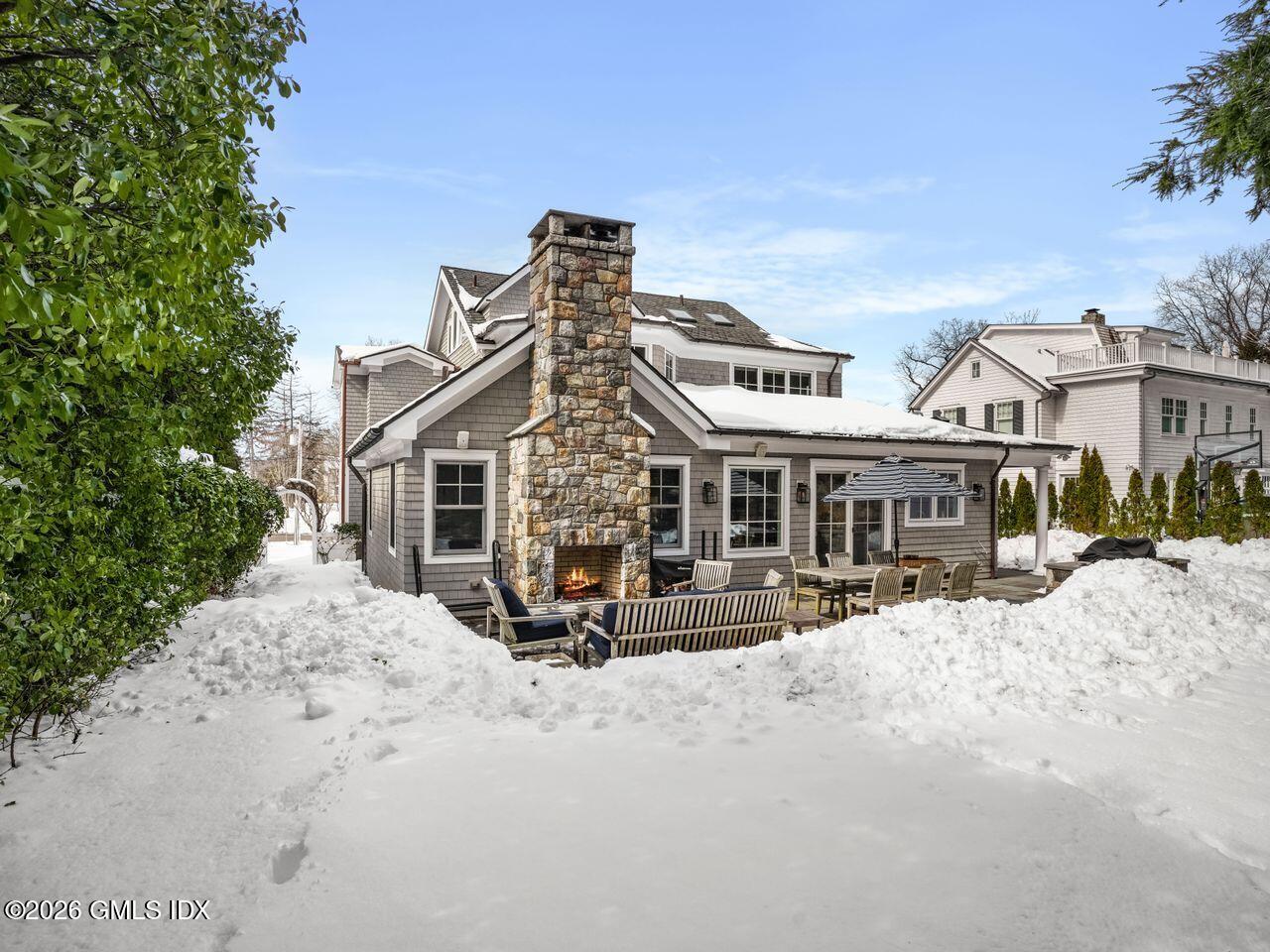 21 Lake Drive Riverside, CT 06878 - Photo 34 of 39 a view of a house with a yard covered in snow