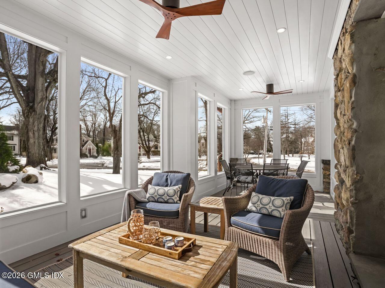 21 Lake Drive Riverside, CT 06878 - Photo 5 of 39 a living room with furniture and a floor to ceiling window