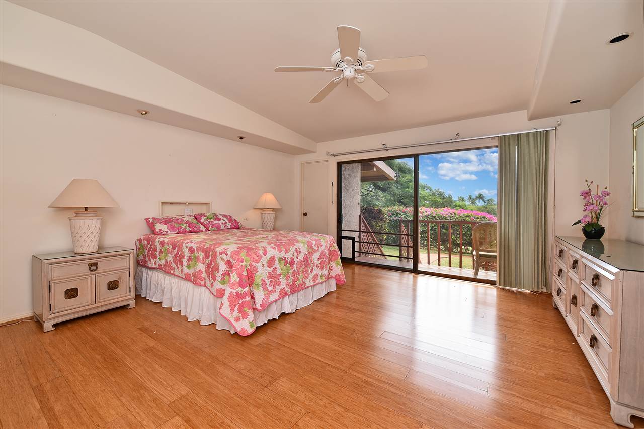 166 Halelo Street Lahaina, HI 96761 - Photo 26 of 27 a bedroom with a bed and wooden floor