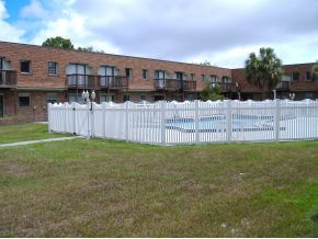 1300 Northeast Arlington, Unit 124 Palm Bay, FL 32905 - Photo 5 of 6 a view of a backyard with a garden