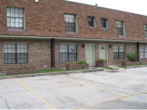 1300 Northeast Arlington, Unit 124 Palm Bay, FL 32905 - Photo 6 of 6 a brick building that has a lots of windows