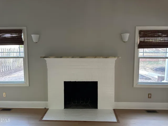 a kitchen with a stove sink and a granite counter top