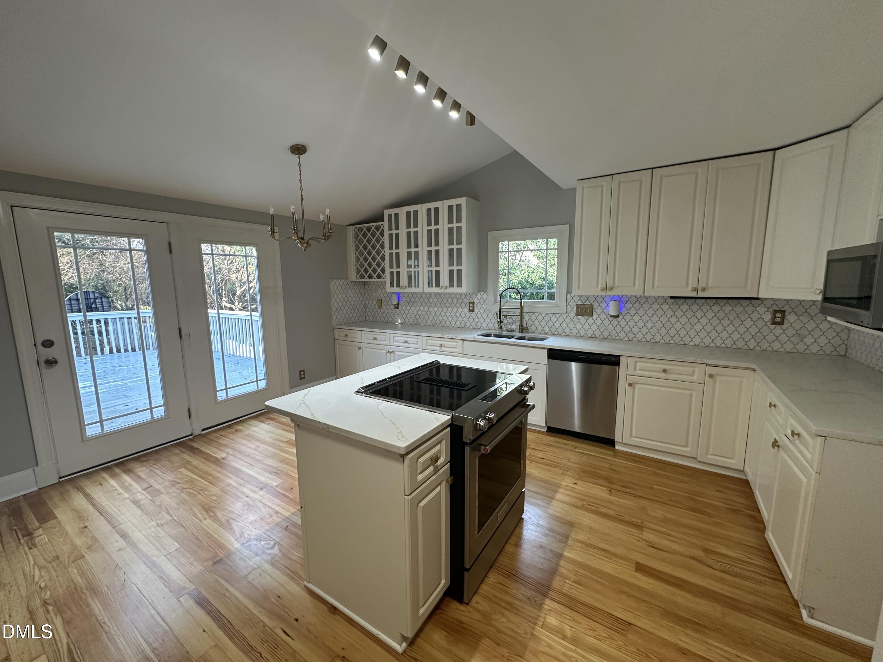2610 Dover Road Raleigh, NC 27608 - Photo 12 of 53 a kitchen with a stove sink and a granite counter top