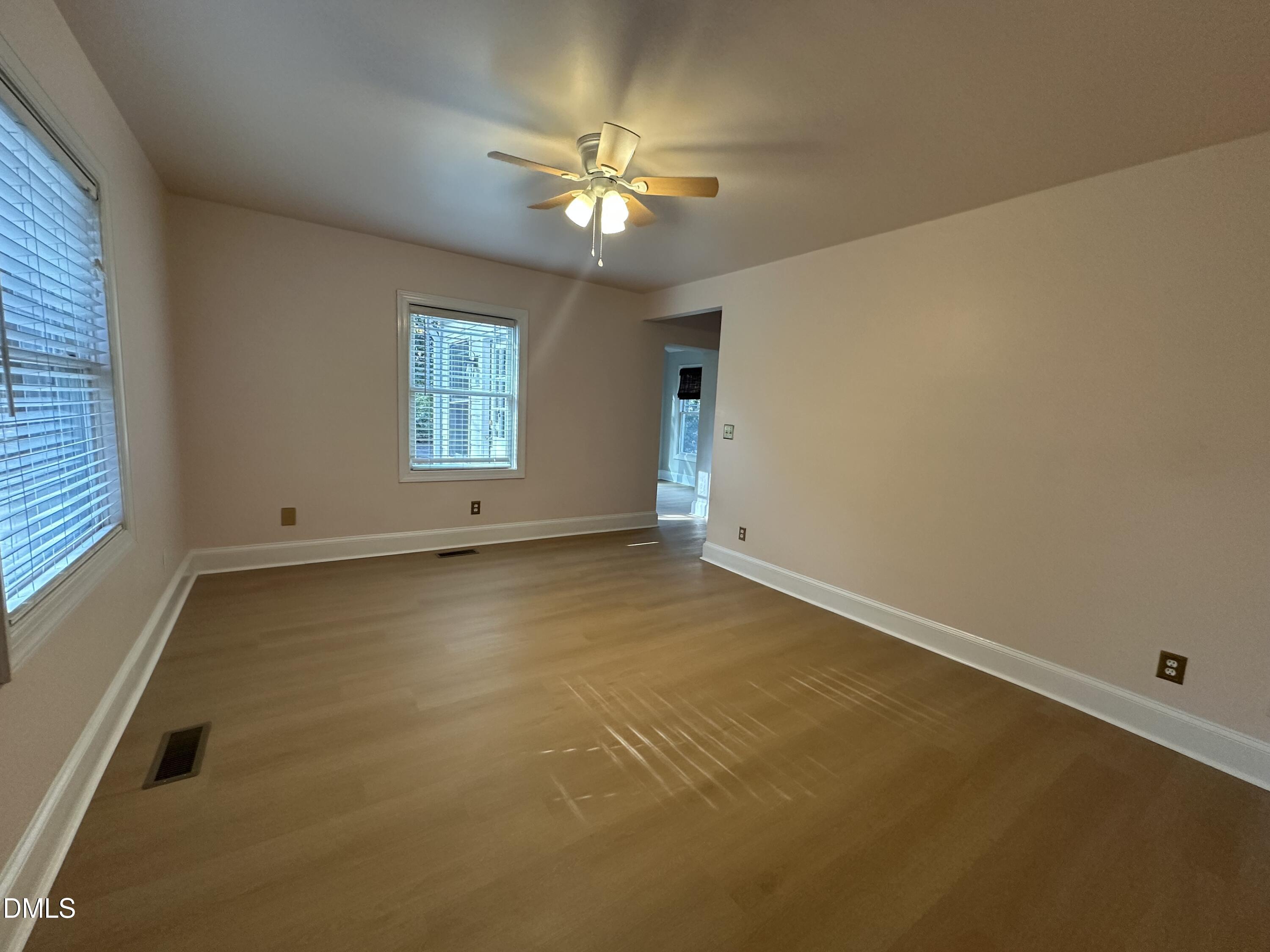 2610 Dover Road Raleigh, NC 27608 - Photo 25 of 53 an empty room with a ceiling fan and window