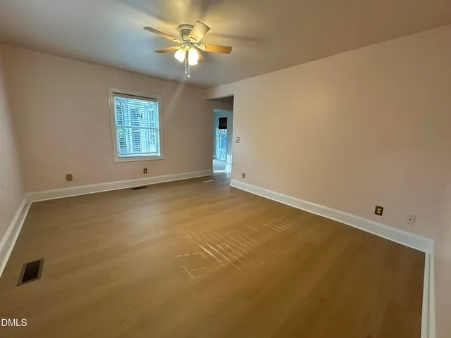 a view of empty room with windows