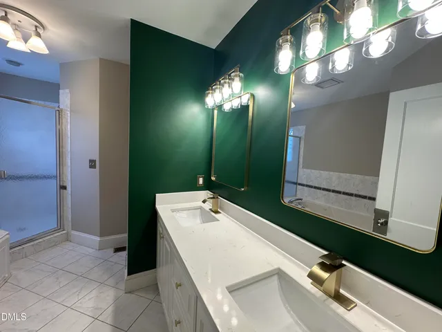 a bathroom with a tub shower and a sink