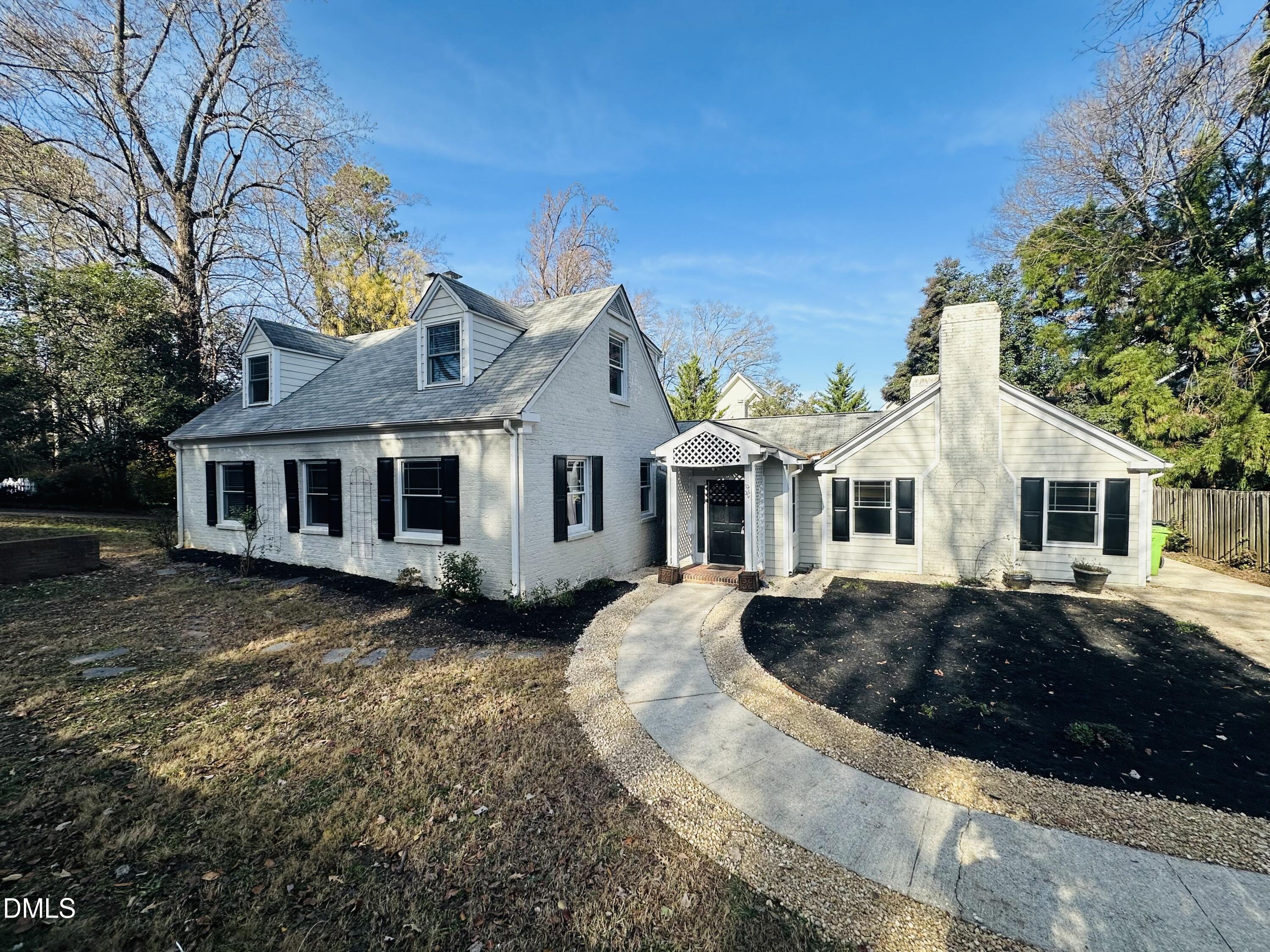 2610 Dover Road Raleigh, NC 27608 - Photo 3 of 53 a front view of a house with a garden