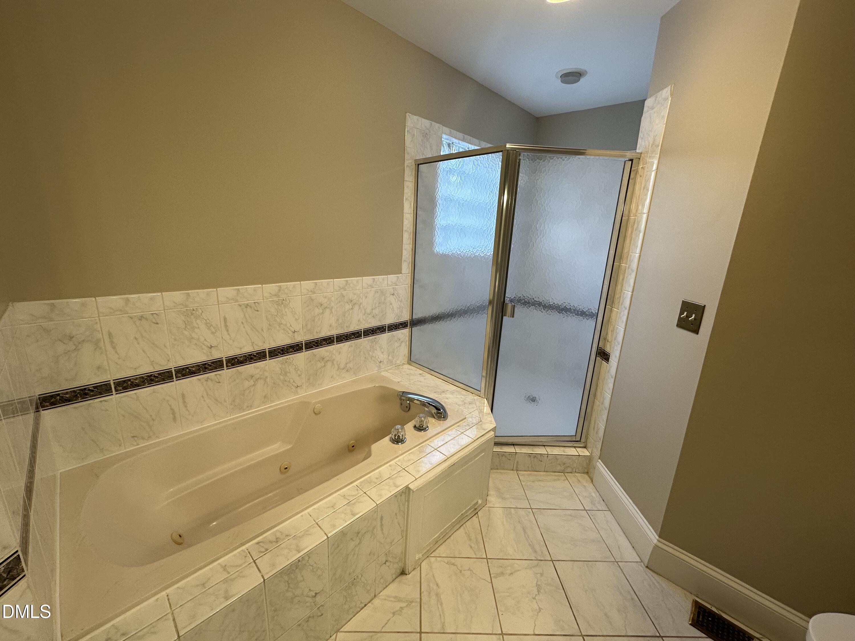 2610 Dover Road Raleigh, NC 27608 - Photo 32 of 53 a bathroom with a tub shower and a sink