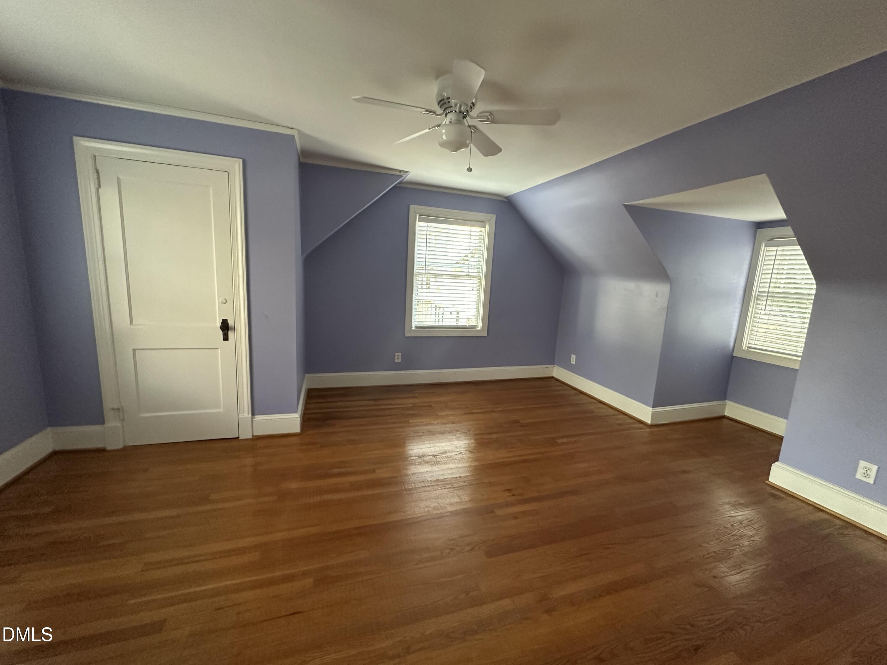 2610 Dover Road Raleigh, NC 27608 - Photo 35 of 53 an empty room with wooden floor and windows