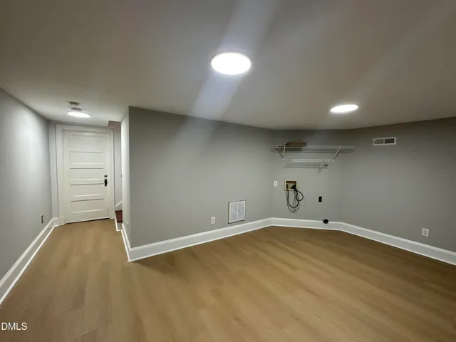 a view of a balcony with wooden floor