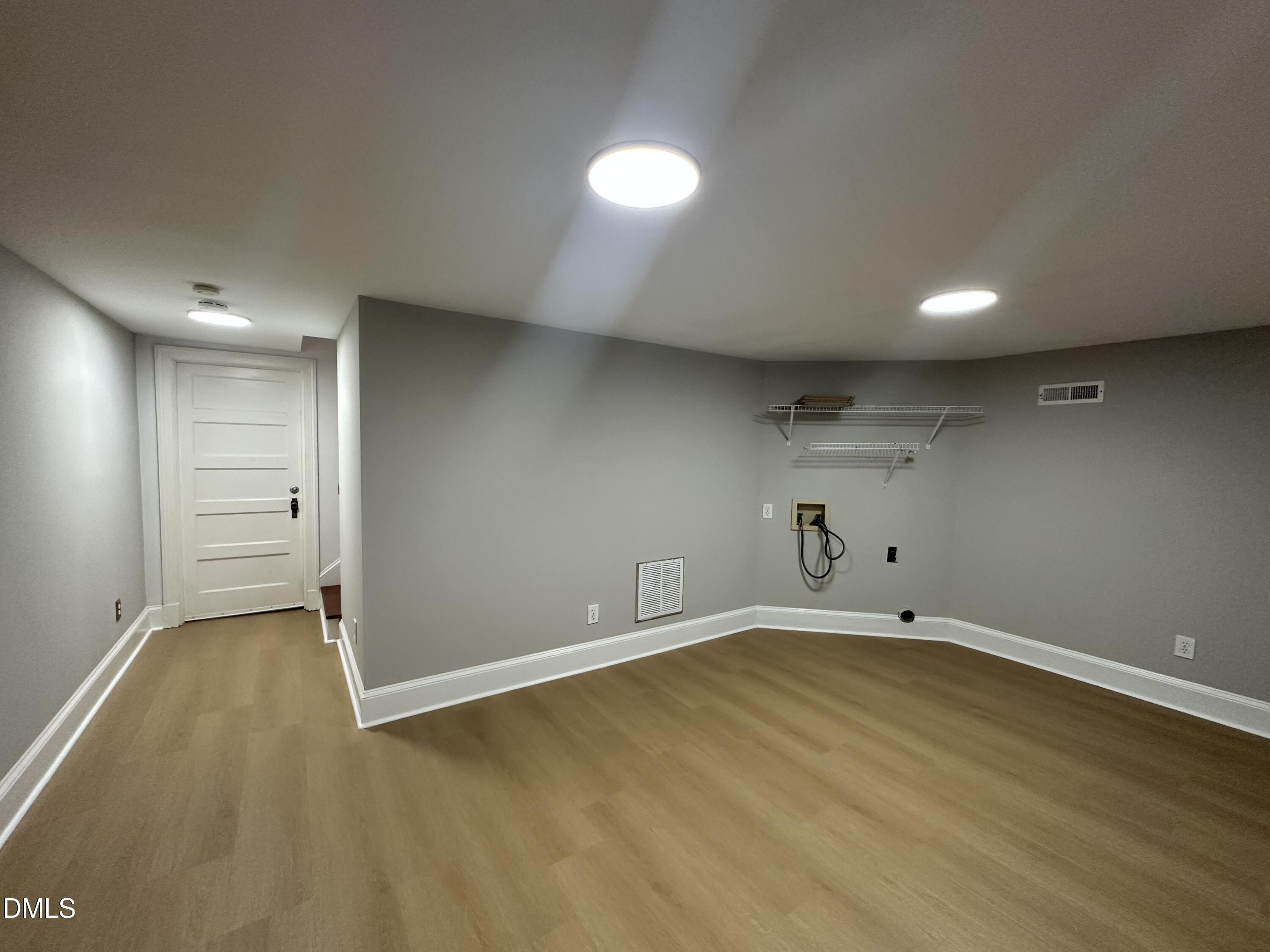 2610 Dover Road Raleigh, NC 27608 - Photo 40 of 53 an empty room with wooden floor and windows