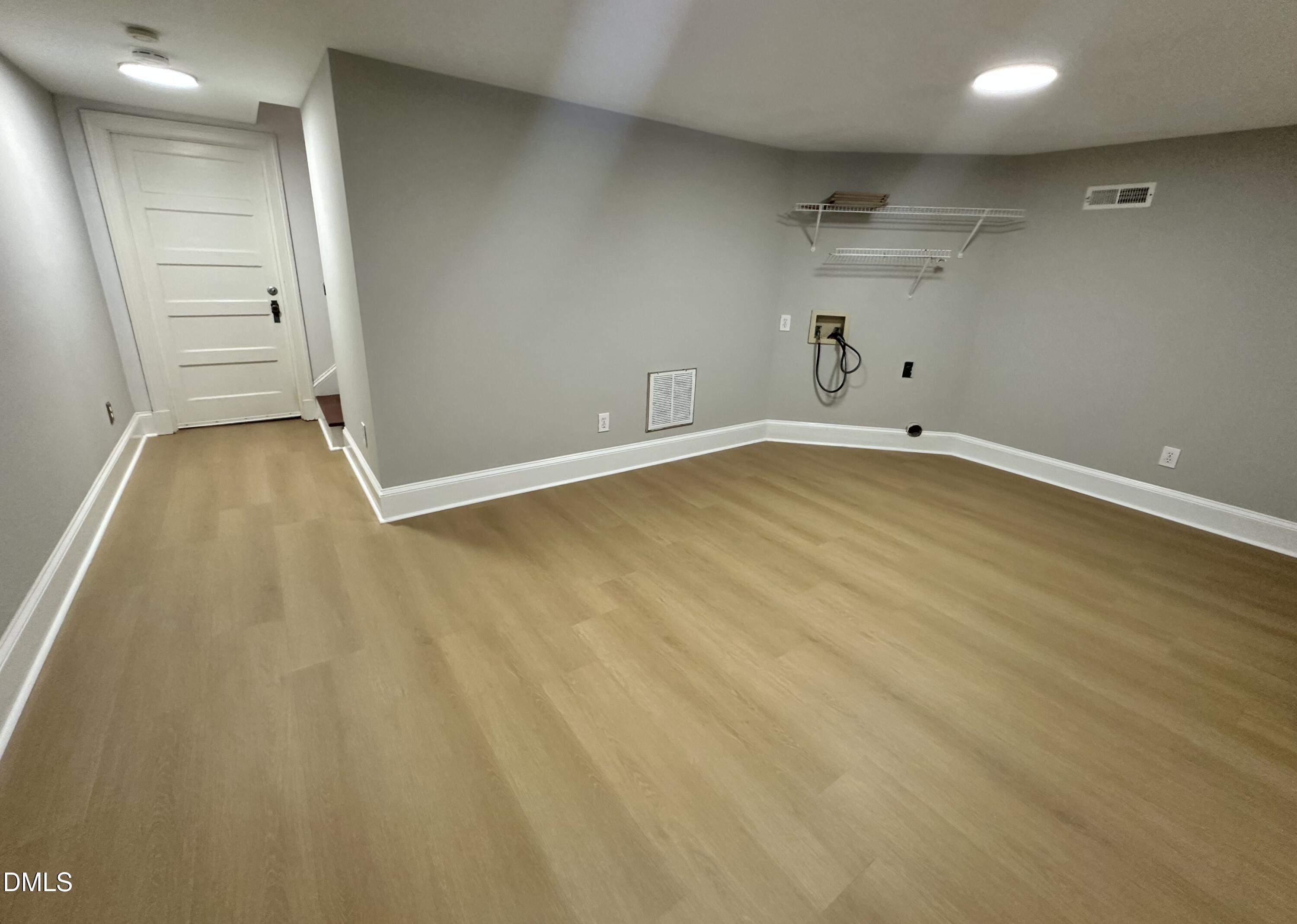 2610 Dover Road Raleigh, NC 27608 - Photo 41 of 53 an empty room with closet and wooden floor