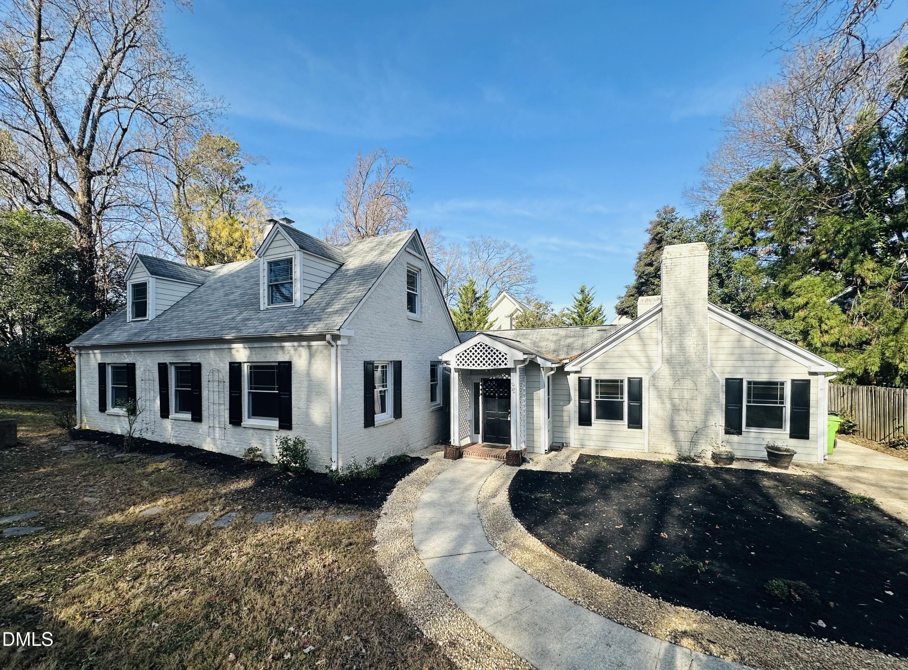 2610 Dover Road Raleigh, NC 27608 - Photo 5 of 53 a front view of a house with a yard