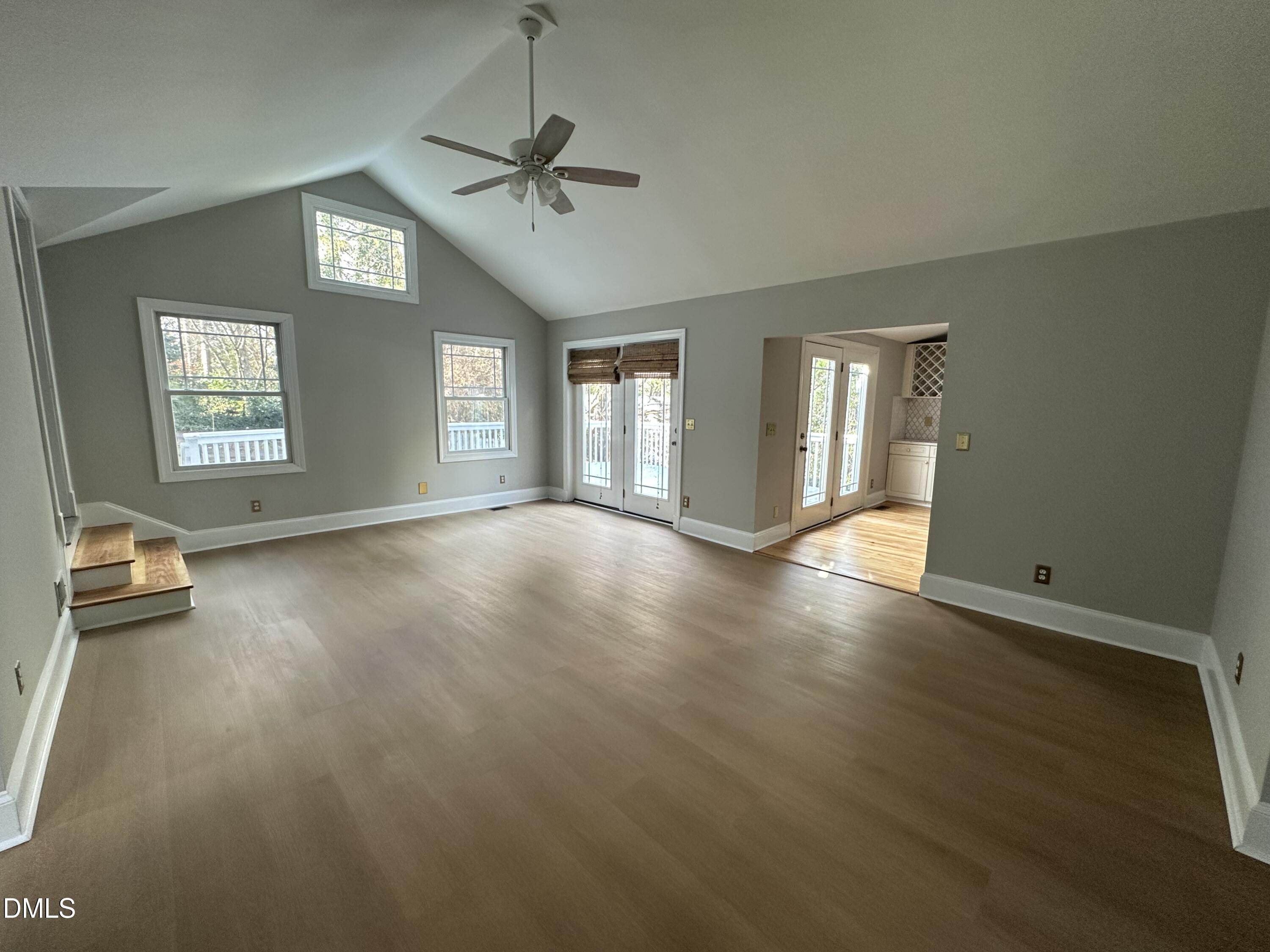 2610 Dover Road Raleigh, NC 27608 - Photo 8 of 53 a view of livingroom with hardwood floor and window