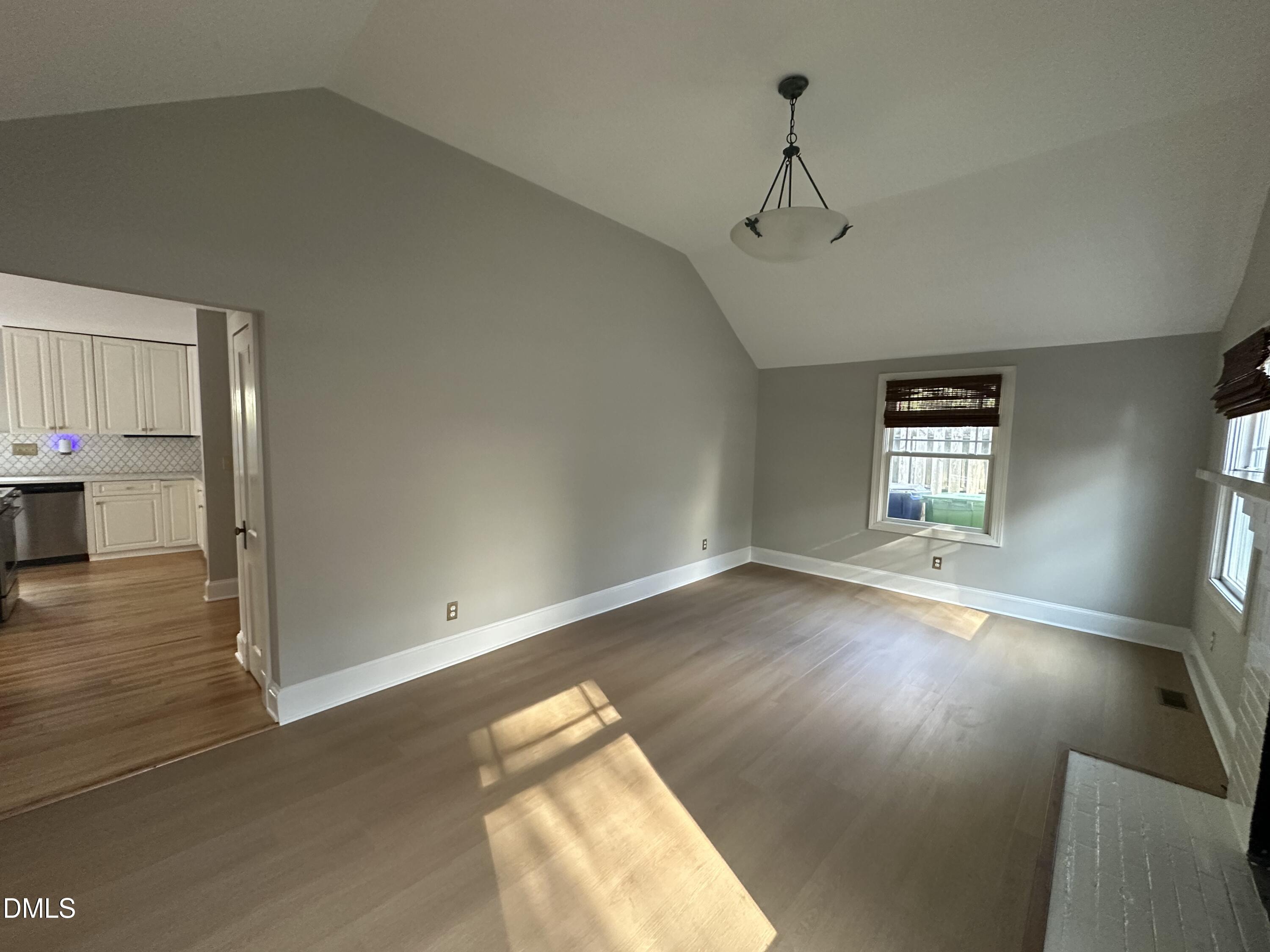 2610 Dover Road Raleigh, NC 27608 - Photo 9 of 53 wooden floor in an empty room with a window