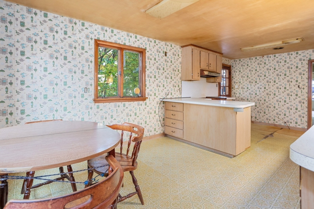 35 Summer Street Saugus, MA 01906 - Photo 14 of 31 a dining room with furniture a window and wooden floor