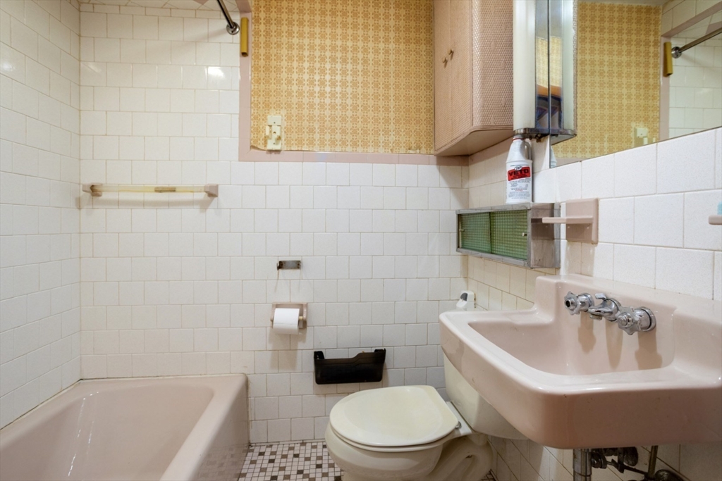 35 Summer Street Saugus, MA 01906 - Photo 19 of 31 a bathroom with a sink toilet and shower