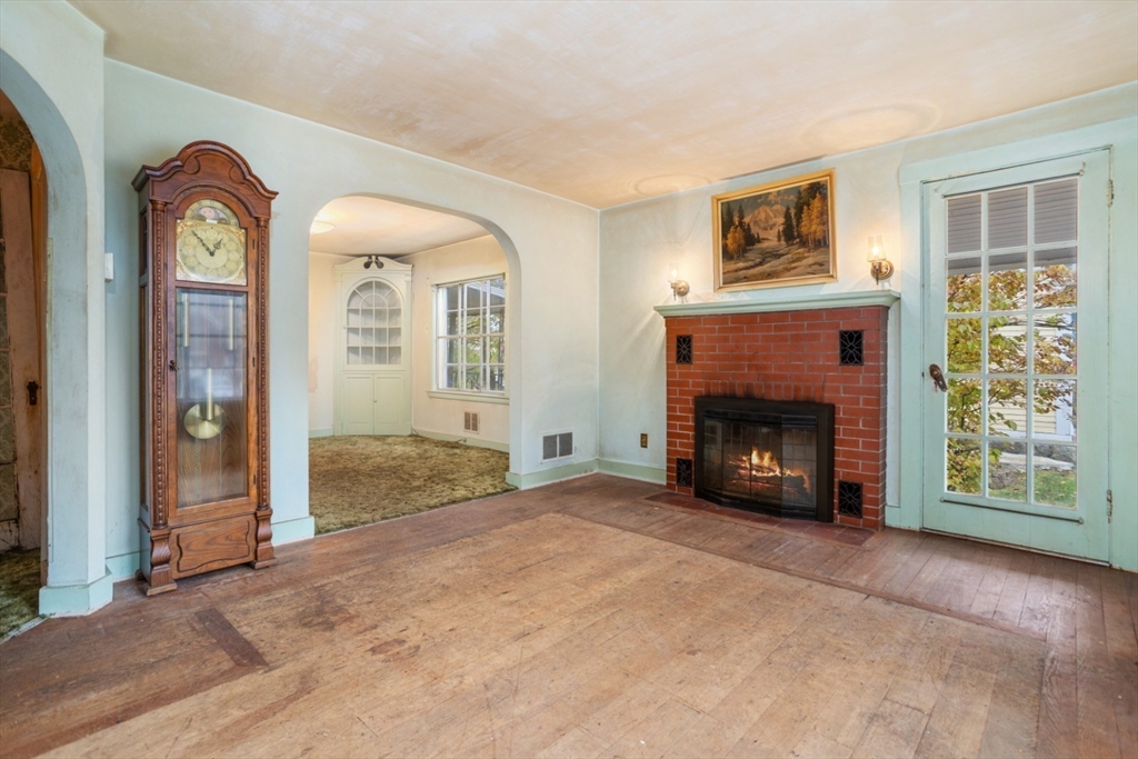 35 Summer Street Saugus, MA 01906 - Photo 6 of 31 a view of livingroom with fireplace and window