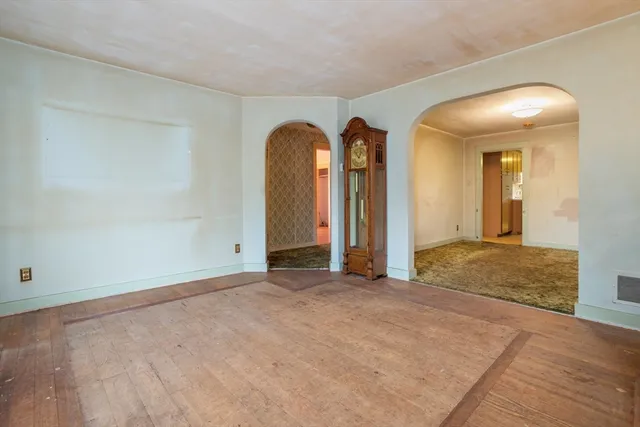 a view of an empty room with a fireplace
