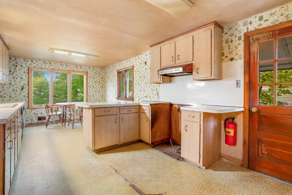 35 Summer Street Saugus, MA 01906 - Photo 10 of 31 a kitchen with sink cabinets and window