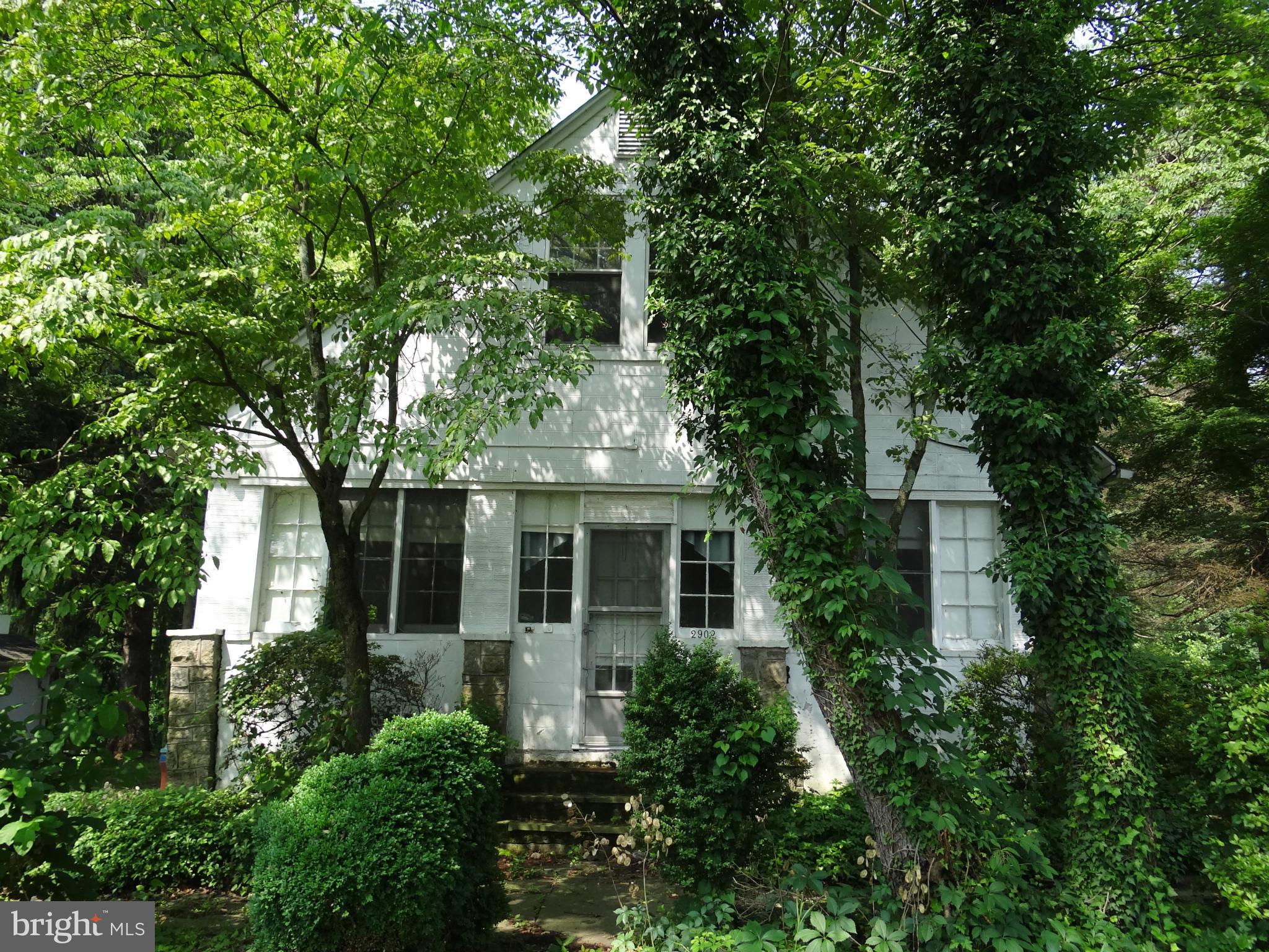 2902 Ridge Road Baltimore, MD 21244 - Photo 1 of 23 front view of a house with a tree