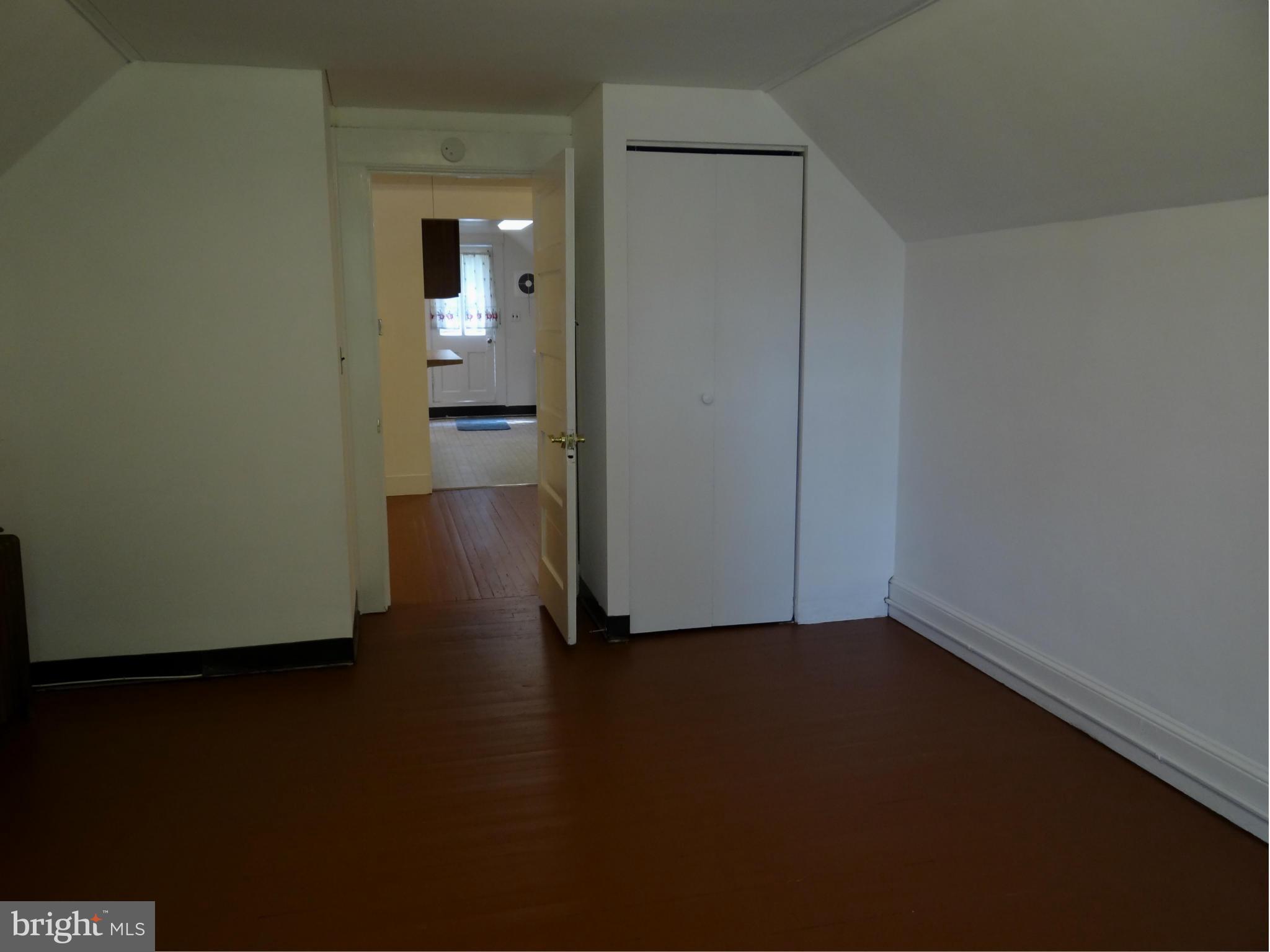 2902 Ridge Road Baltimore, MD 21244 - Photo 17 of 23 a view of a room with wooden floor and a bathroom