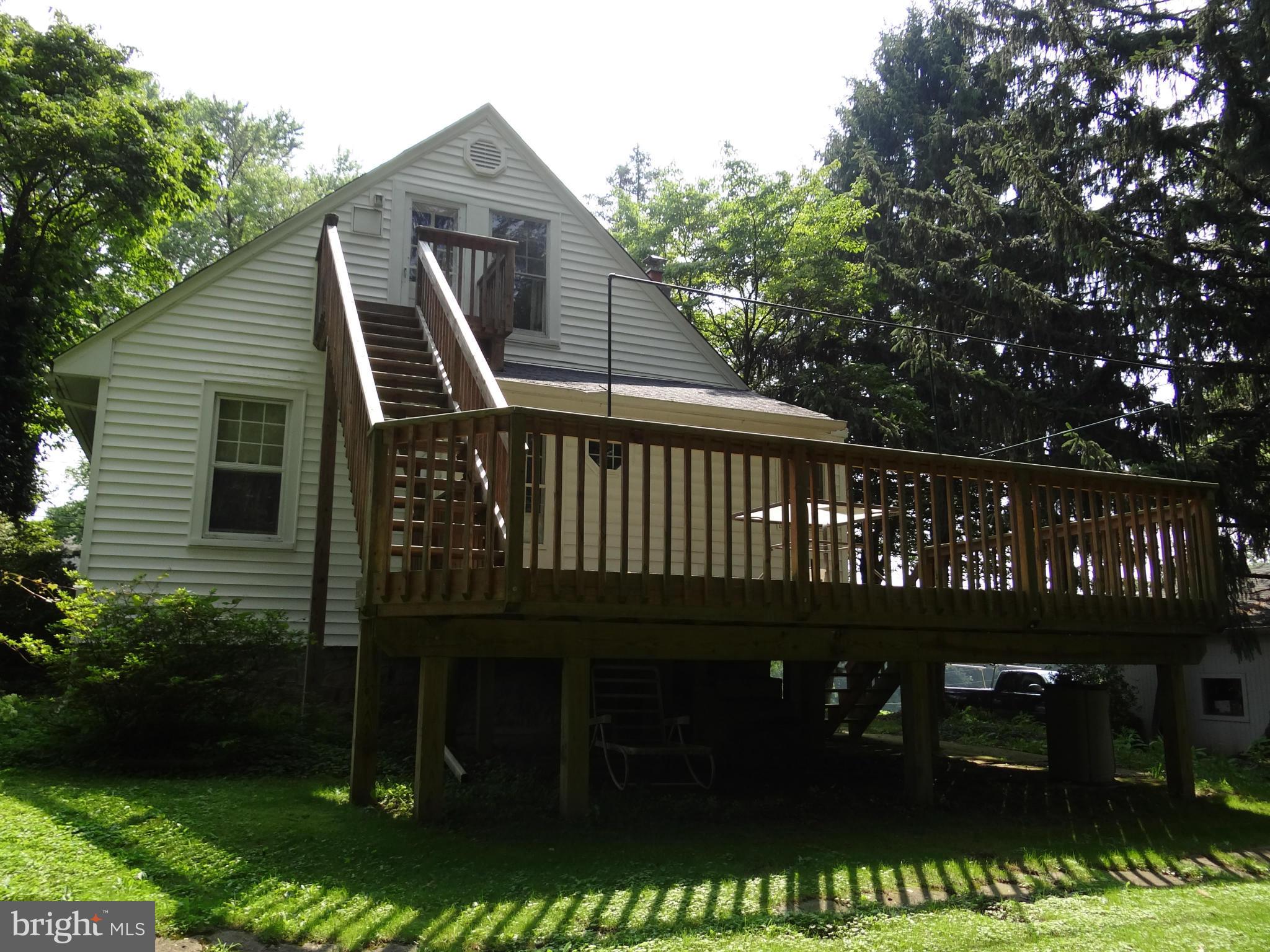 2902 Ridge Road Baltimore, MD 21244 - Photo 18 of 23 a view of a wooden deck and a yard