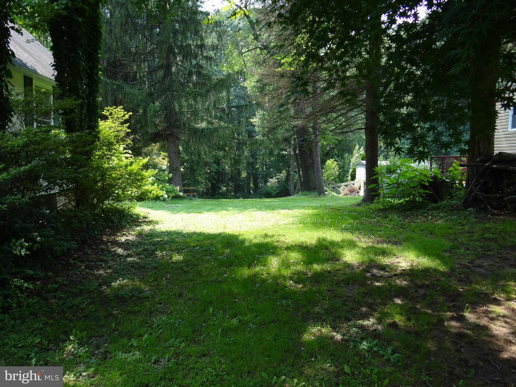 2902 Ridge Road Baltimore, MD 21244 - Photo 21 of 23 a view of a big yard with large trees