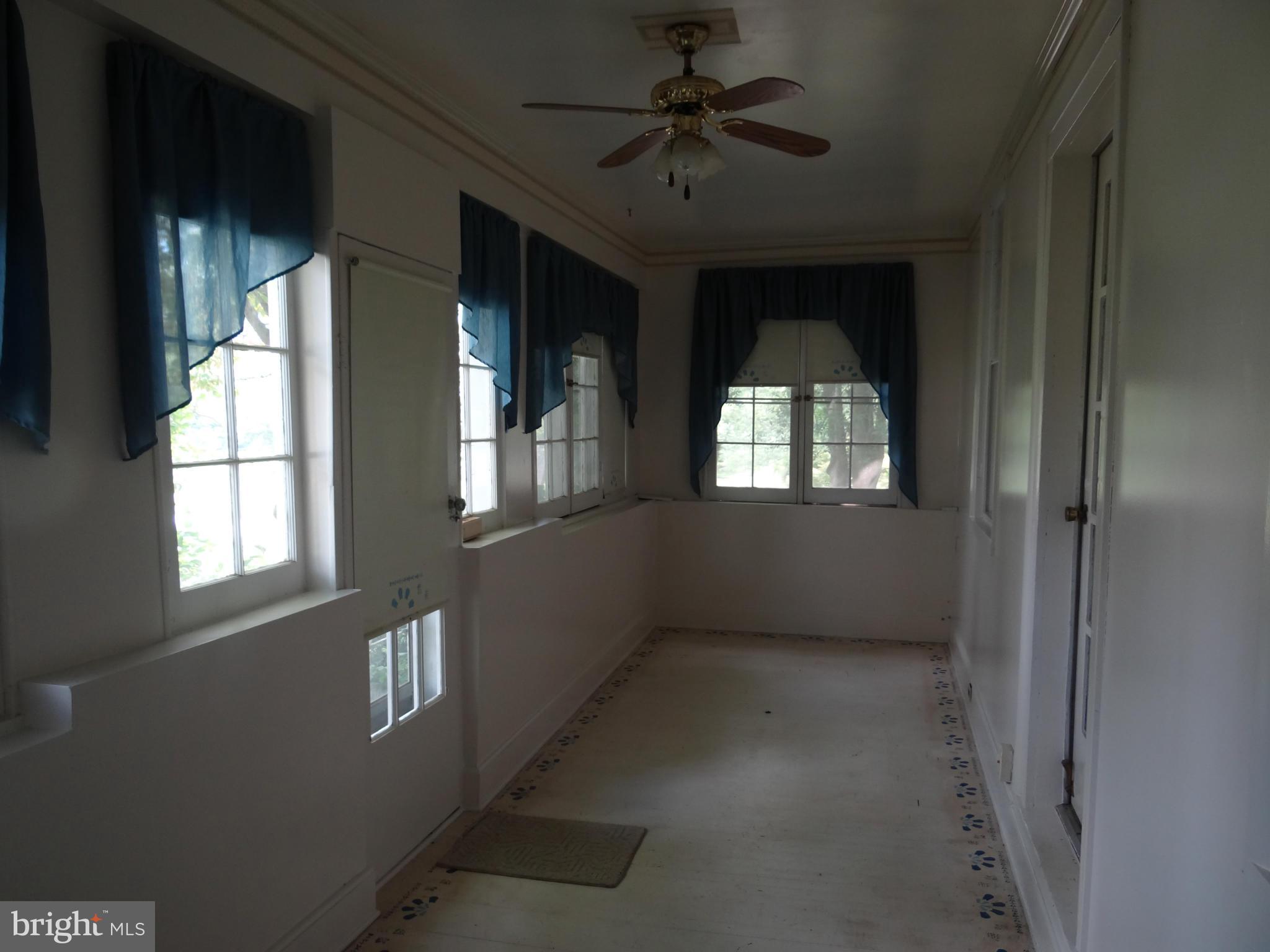 2902 Ridge Road Baltimore, MD 21244 - Photo 4 of 23 a view of empty room with windows